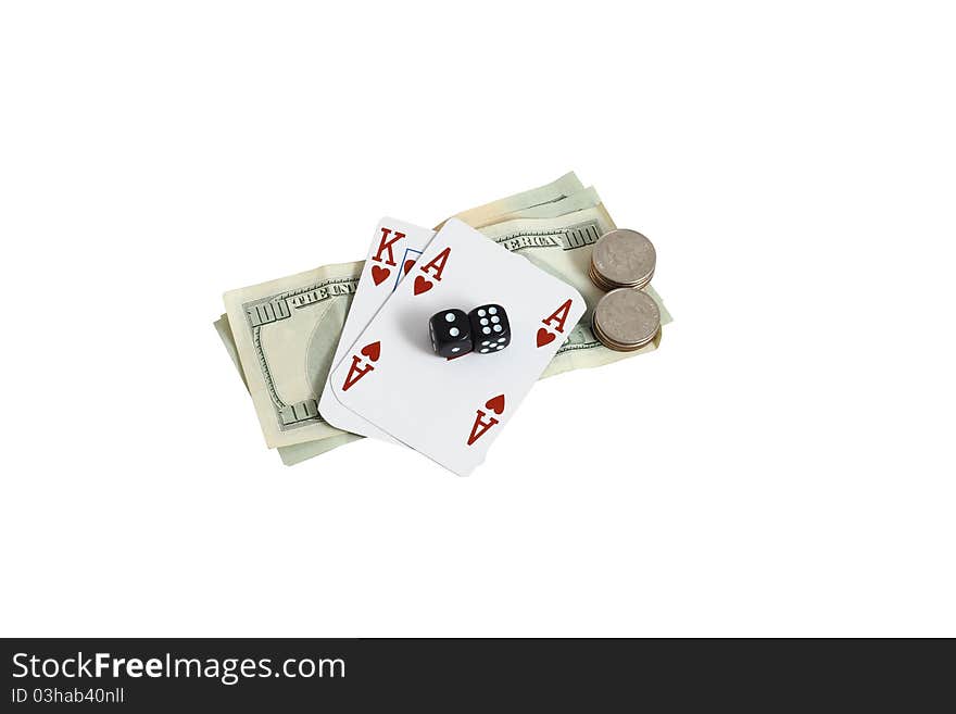 Cards and dice on top a pile of money. Isolated on a white background. Cards and dice on top a pile of money. Isolated on a white background.