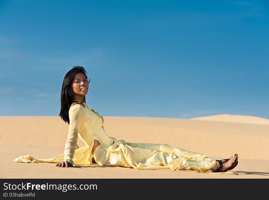 Joyous young woman in dunes