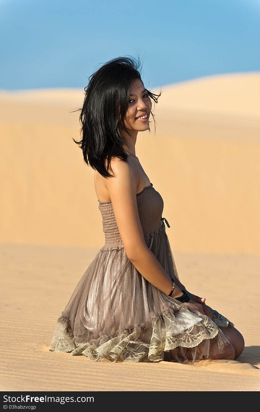 Joyous young woman in dunes