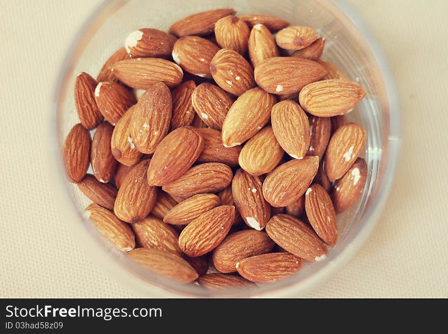 Tasty and useful almonds in a glass jar