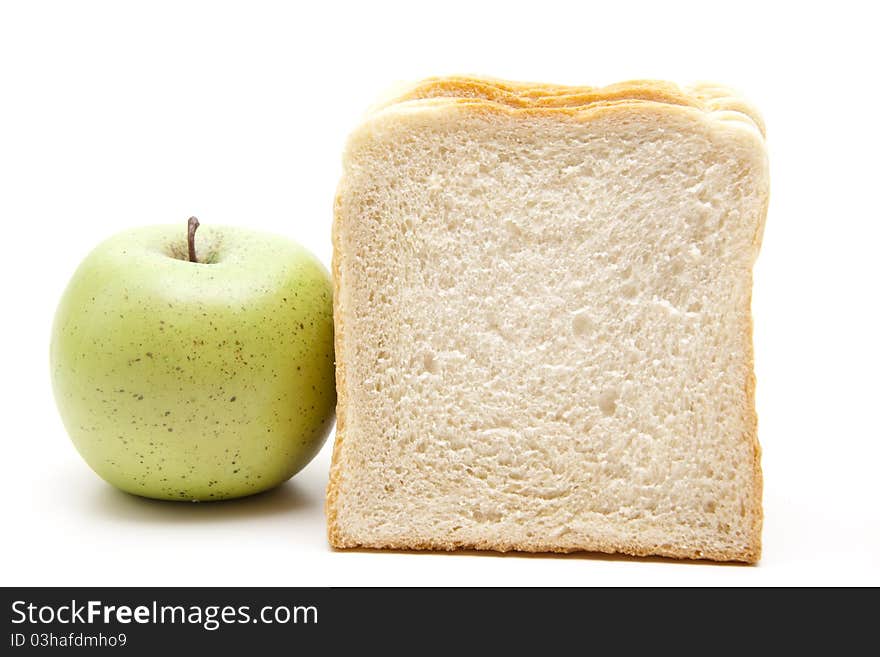 White bread with apple onto white background