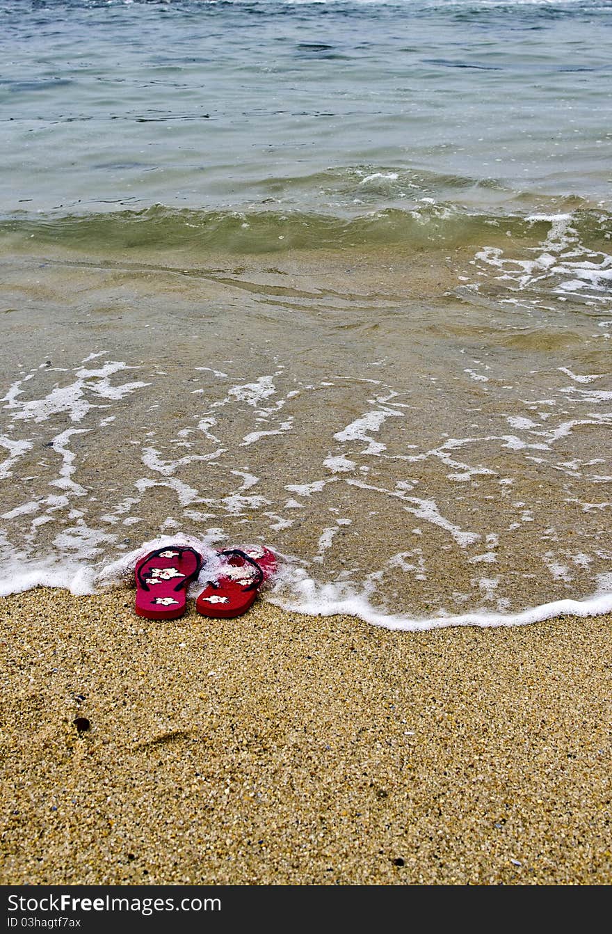 Flipflops In Ocean Water