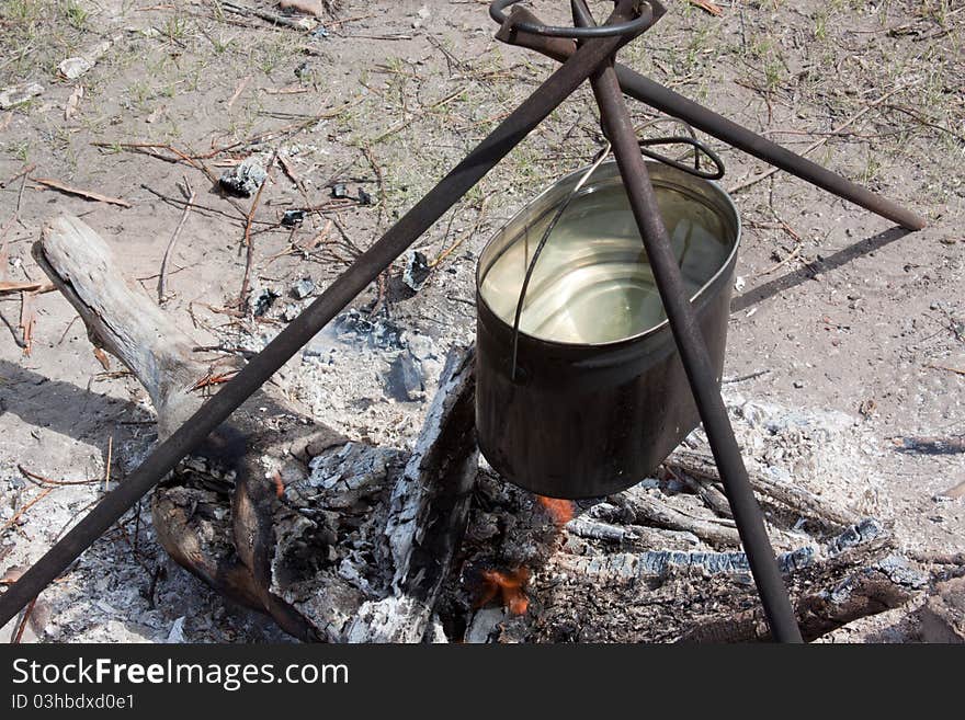 Preparing food on campfire