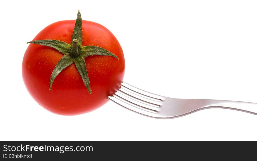 Red tomato on a plug isolated on the white