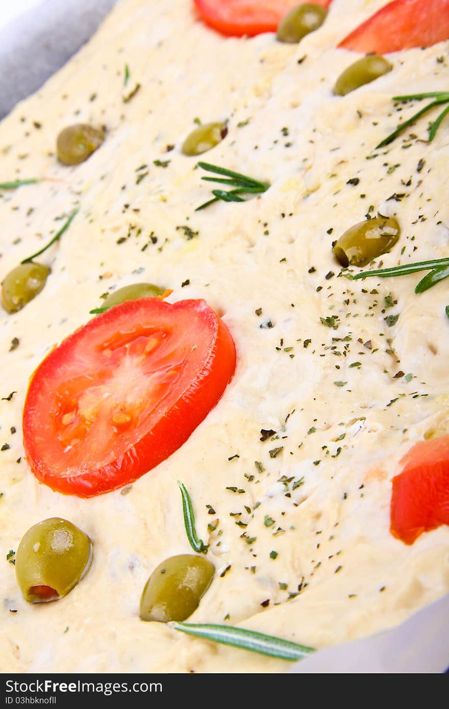 Italian bread, Close up. tomato and olive in the middle of picture