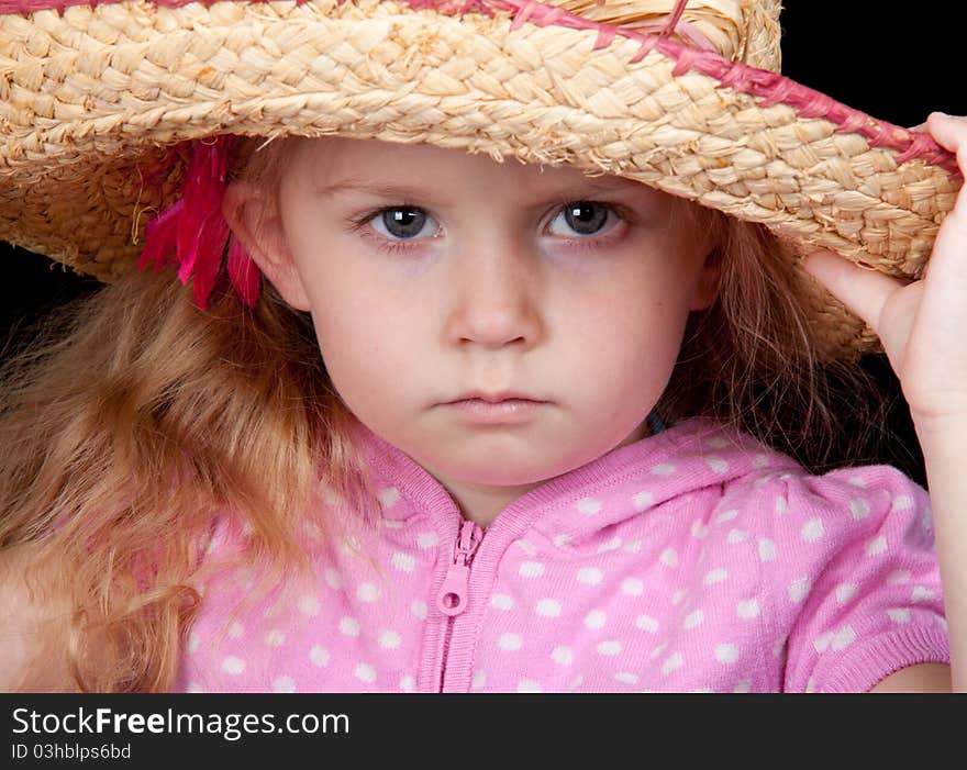 An amazing image of an adorable girl wearing a hat. An amazing image of an adorable girl wearing a hat.