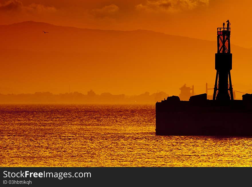 A golden sunset over the bay of Gibraltar taken from Gibraltar looking towards Spain. A golden sunset over the bay of Gibraltar taken from Gibraltar looking towards Spain.