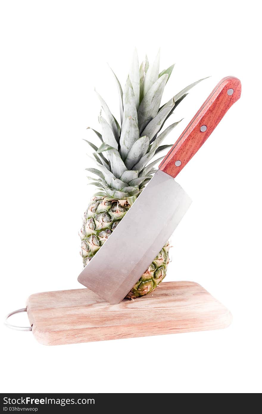 Pineapple in table with blade on white background