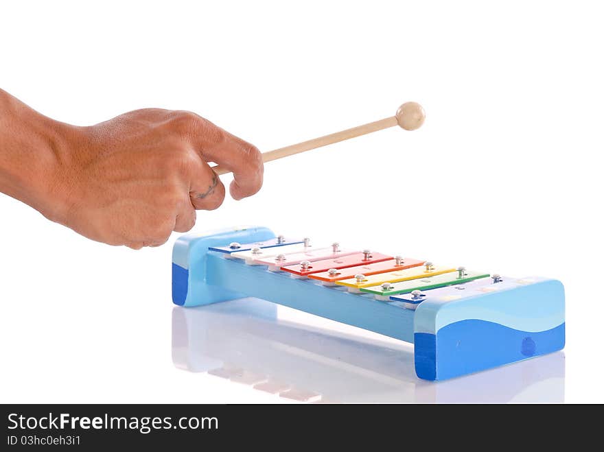 Male Hand Playing a Xylophone