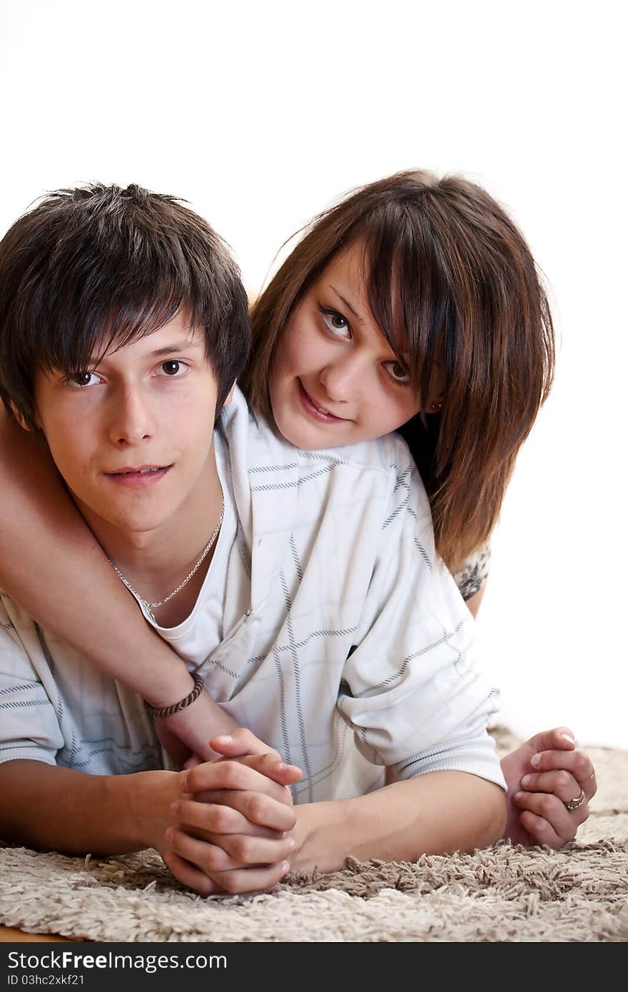 Happy young couple on the carpet