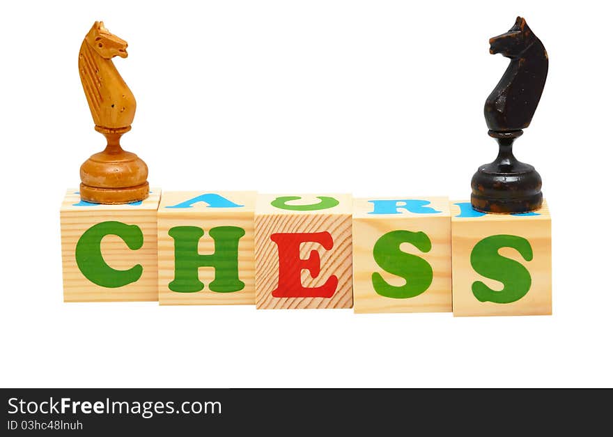 Alphabet wood blocks forming the word chess isolated on a white background. Alphabet wood blocks forming the word chess isolated on a white background