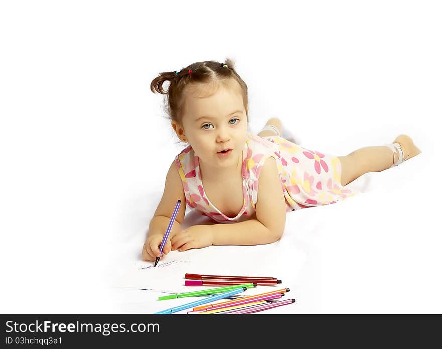 The beautiful girl drawing pencils in a sketch pad on the isolated white background