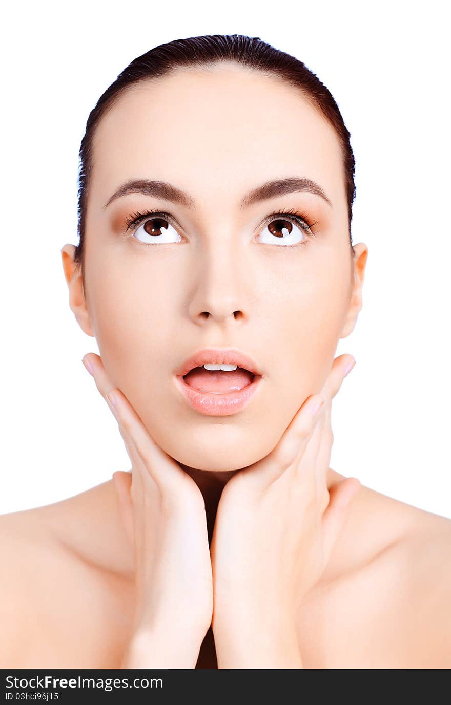 Portrait of a young woman open-mouthed with astonishment. Isolated over white background. Portrait of a young woman open-mouthed with astonishment. Isolated over white background.