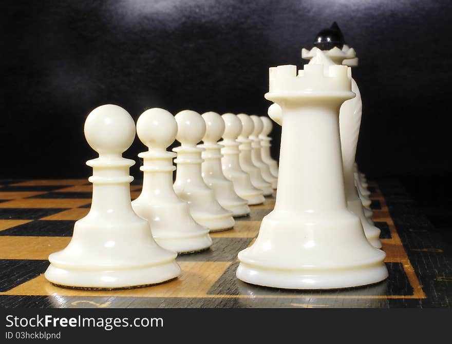 White chess on the chessboard ranked. White chess on the chessboard ranked