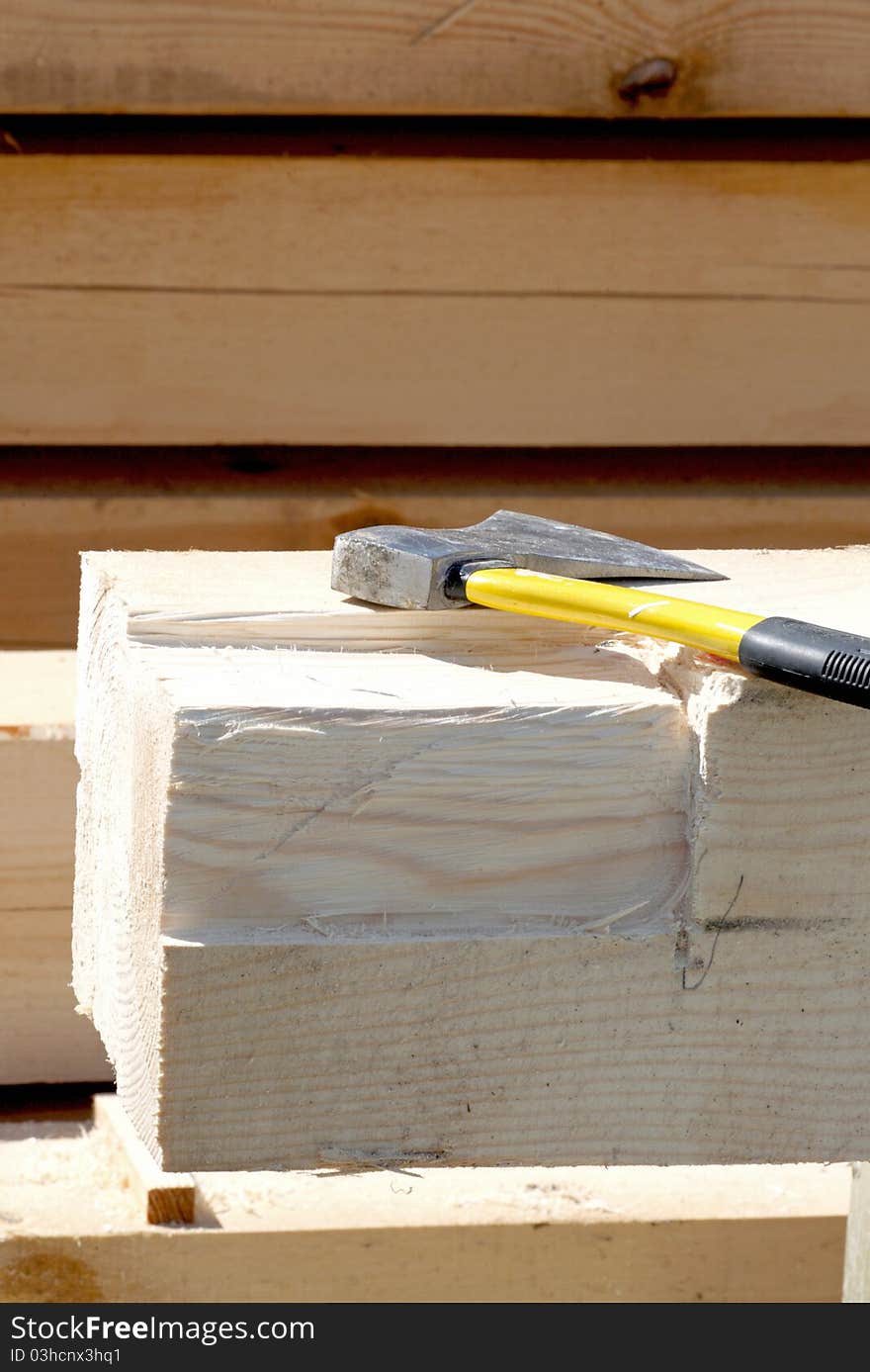 A axe and wood on the building site