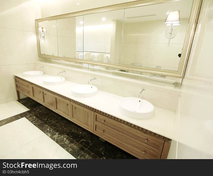 Faucet and washbasin in men lavatory