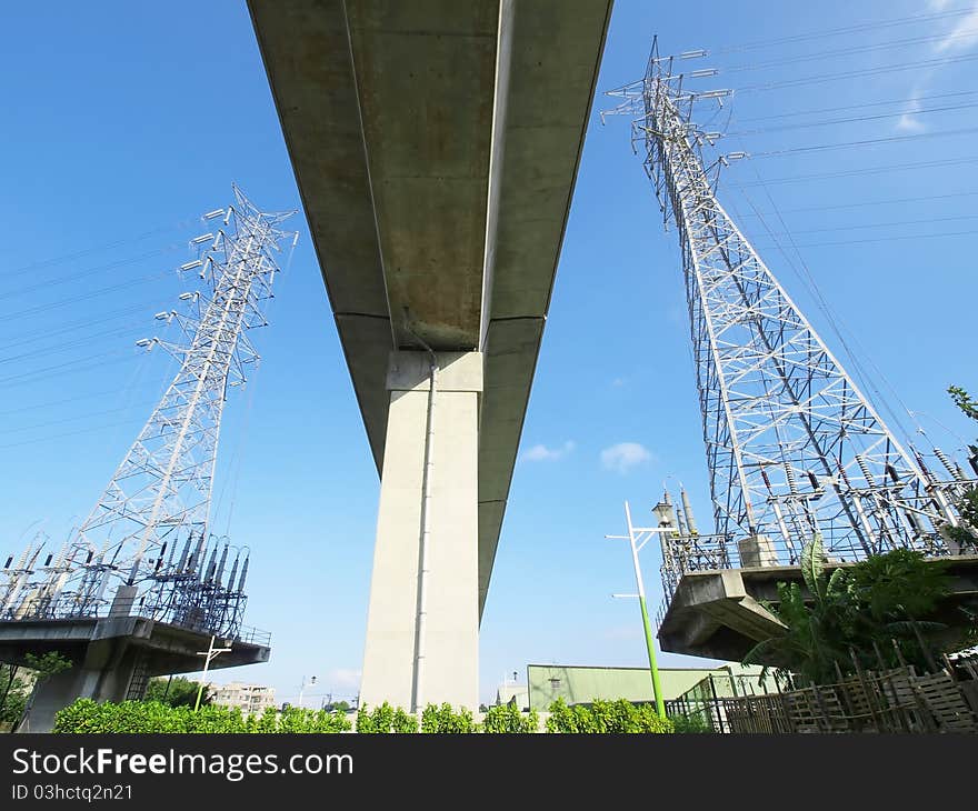 Electric towers near viaduct of high speed train. Electric towers near viaduct of high speed train