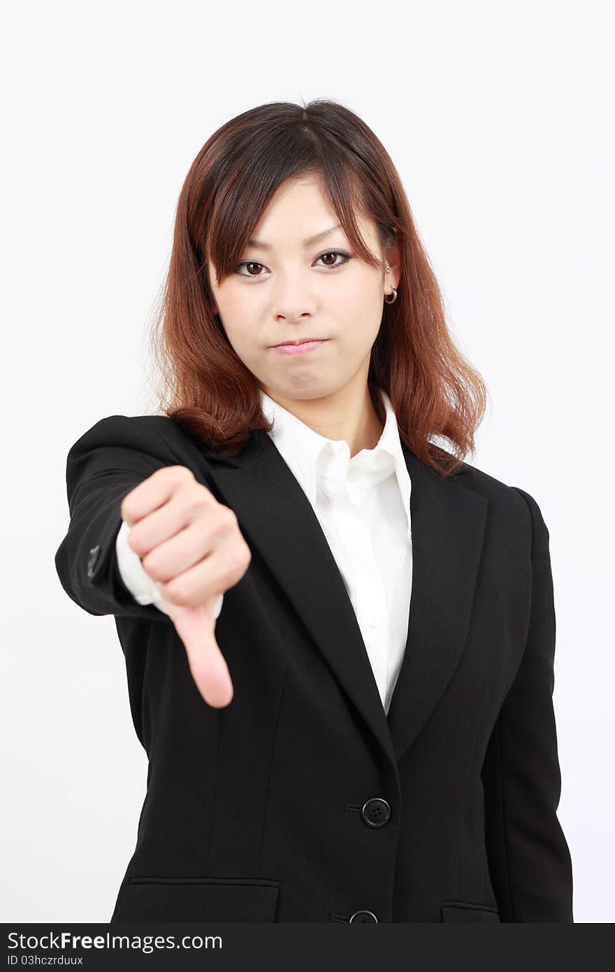 Young asian business woman showing thumb down