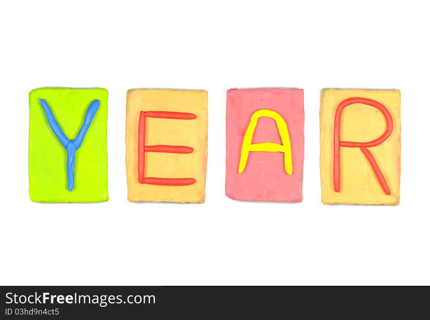 Clay letters. Words YEAR isolated on the white background