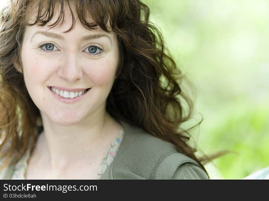 Portrait of a Pretty Young Woman Smiling Directly to the Camera. Portrait of a Pretty Young Woman Smiling Directly to the Camera