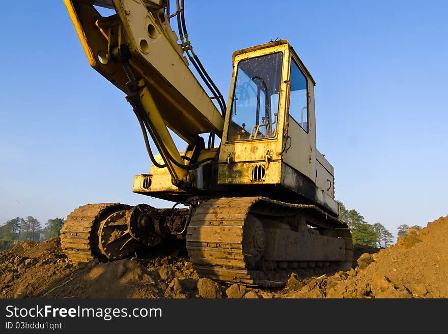 Digger, Heavy Duty construction equipment parked at work site