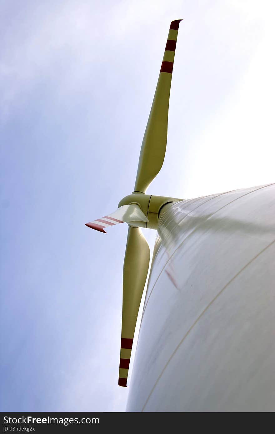 Wind turbines on green field. Alternative source of energy. Wind turbines on green field. Alternative source of energy