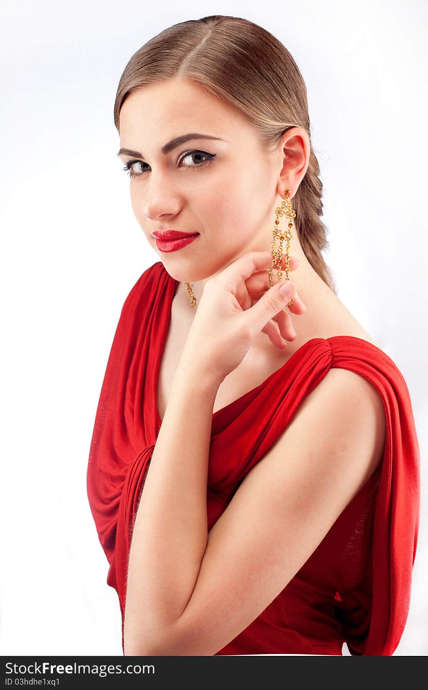 Young beautiful woman with red lips in red dress