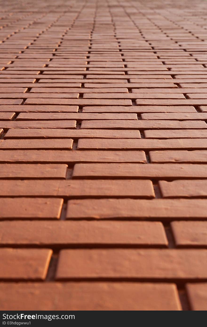 Narrow angle view looking up an impossibly high brick wall