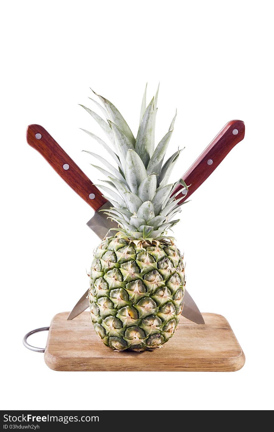 Pineapple in table with knifes on white background