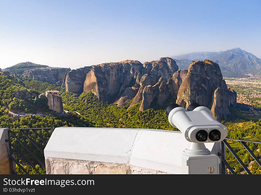 Binoculars and Meteora monastery in Greece