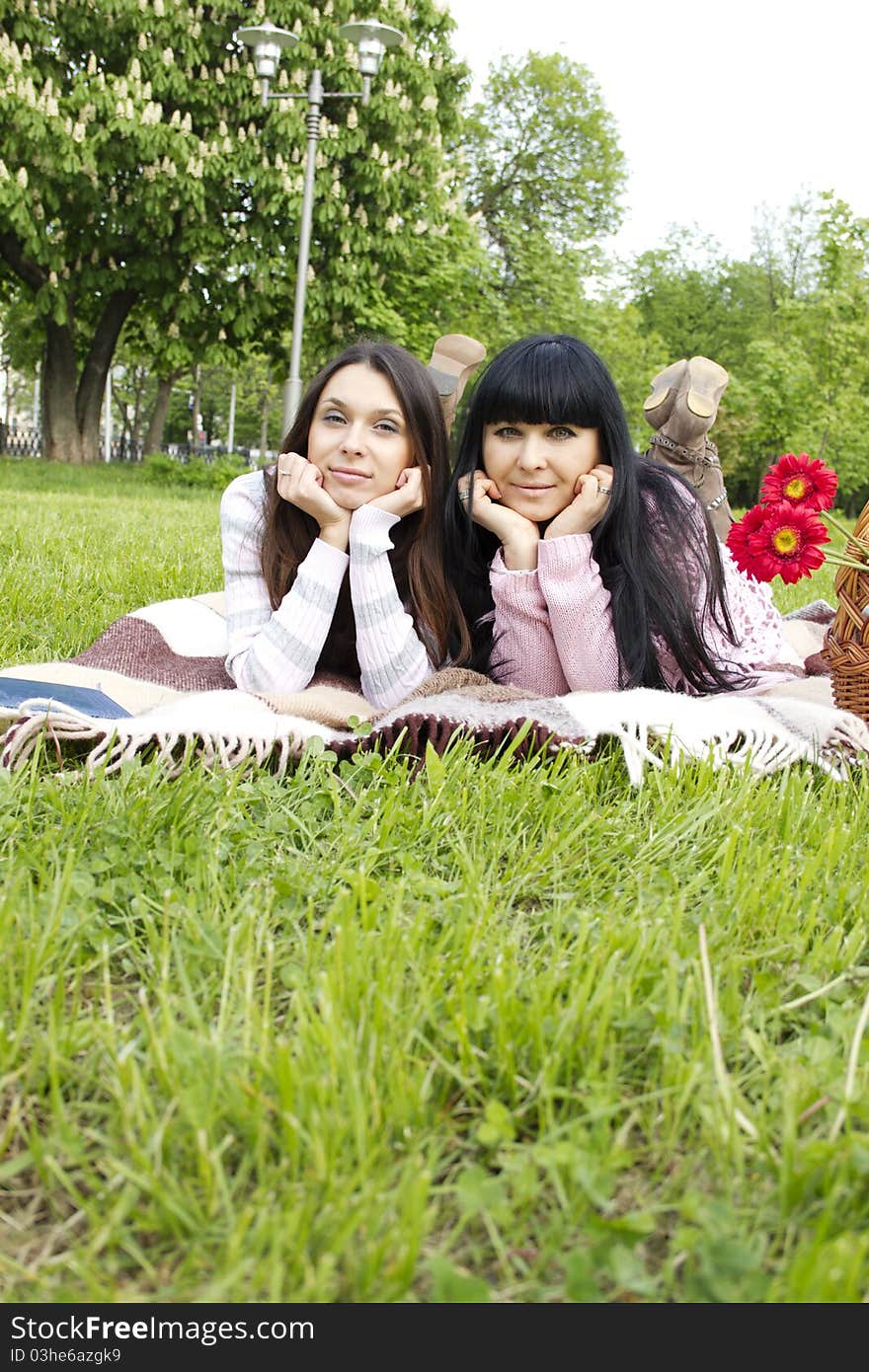 Portrait of smiling mother and teenage daughter in the park happy. Portrait of smiling mother and teenage daughter in the park happy