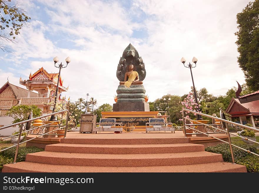 Buddha nature, meditation. And the head of a serpent cobra hood spread from the shoulder to the head of the Buddha, dirty. Buddha nature, meditation. And the head of a serpent cobra hood spread from the shoulder to the head of the Buddha, dirty