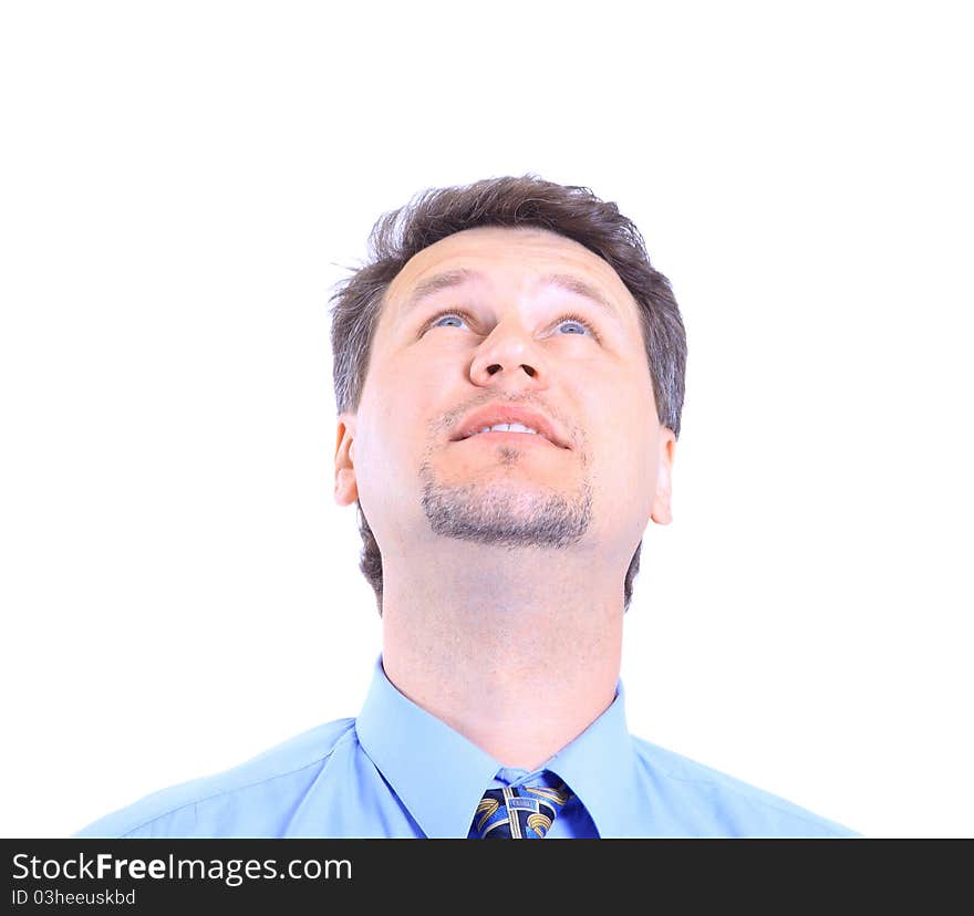 Isolated close-up portrait of a senior businessman. Cheerful and in a suit, looking up.