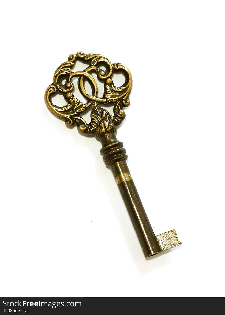 Beautiful old key isolated on white