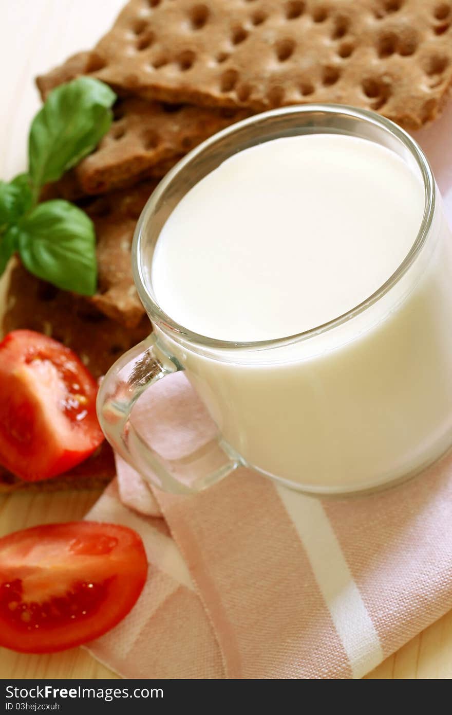 Glass of milk and crackers, healthy breakfast