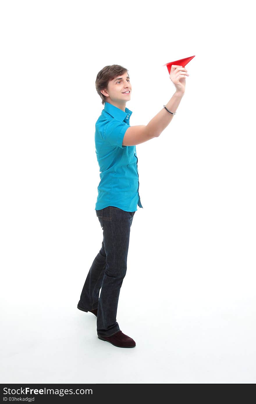 A young man holding a paper airplane