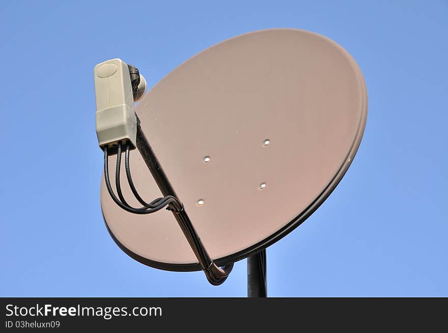 Satellite dish on blue background