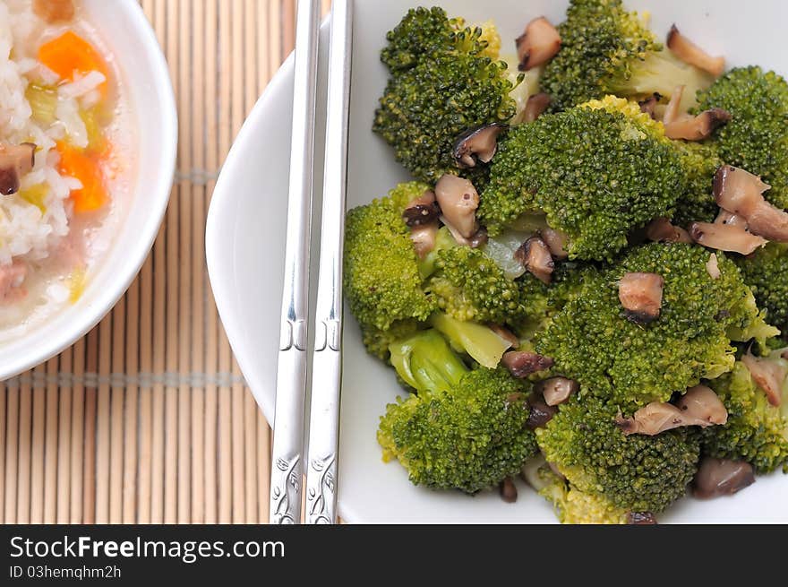 Freshly served green broccoli delicacy served in white bowl. Freshly served green broccoli delicacy served in white bowl.