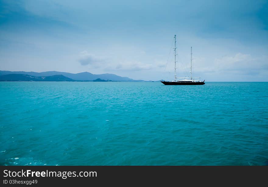 Beautiful sea with a boat against the blue sky