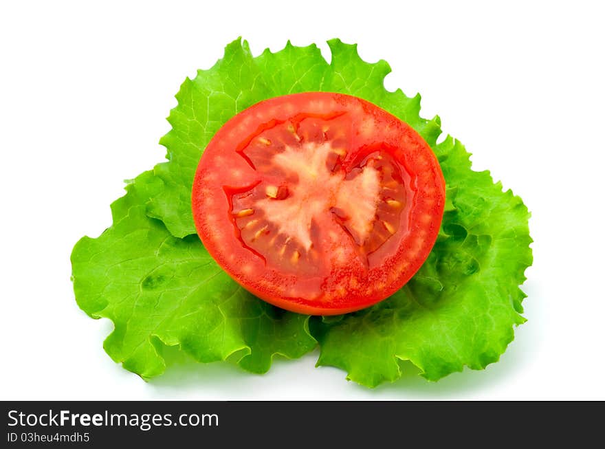 Red tomatoes and lettuce on a white background