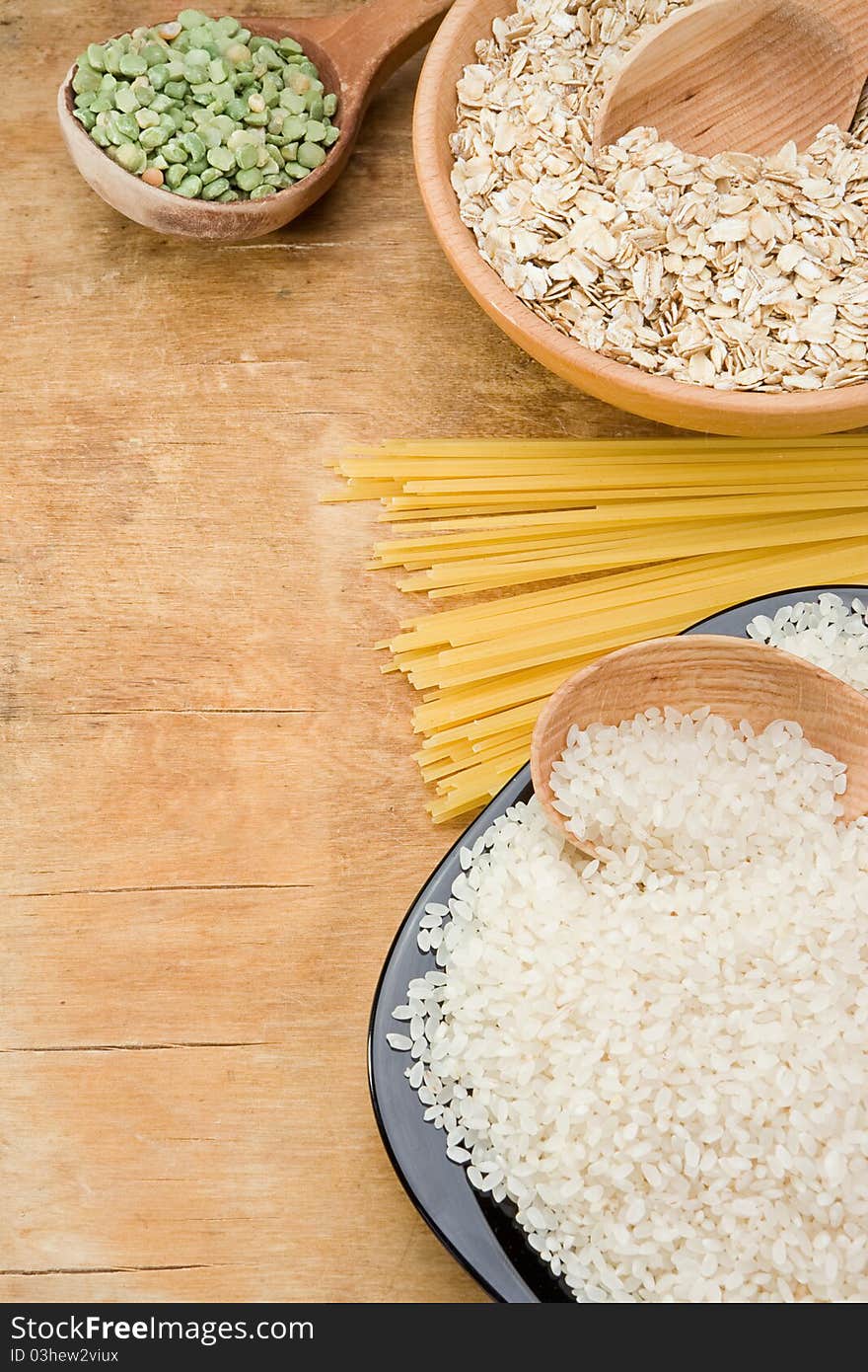 Rice, pea, spaghetti and oat in plate on table