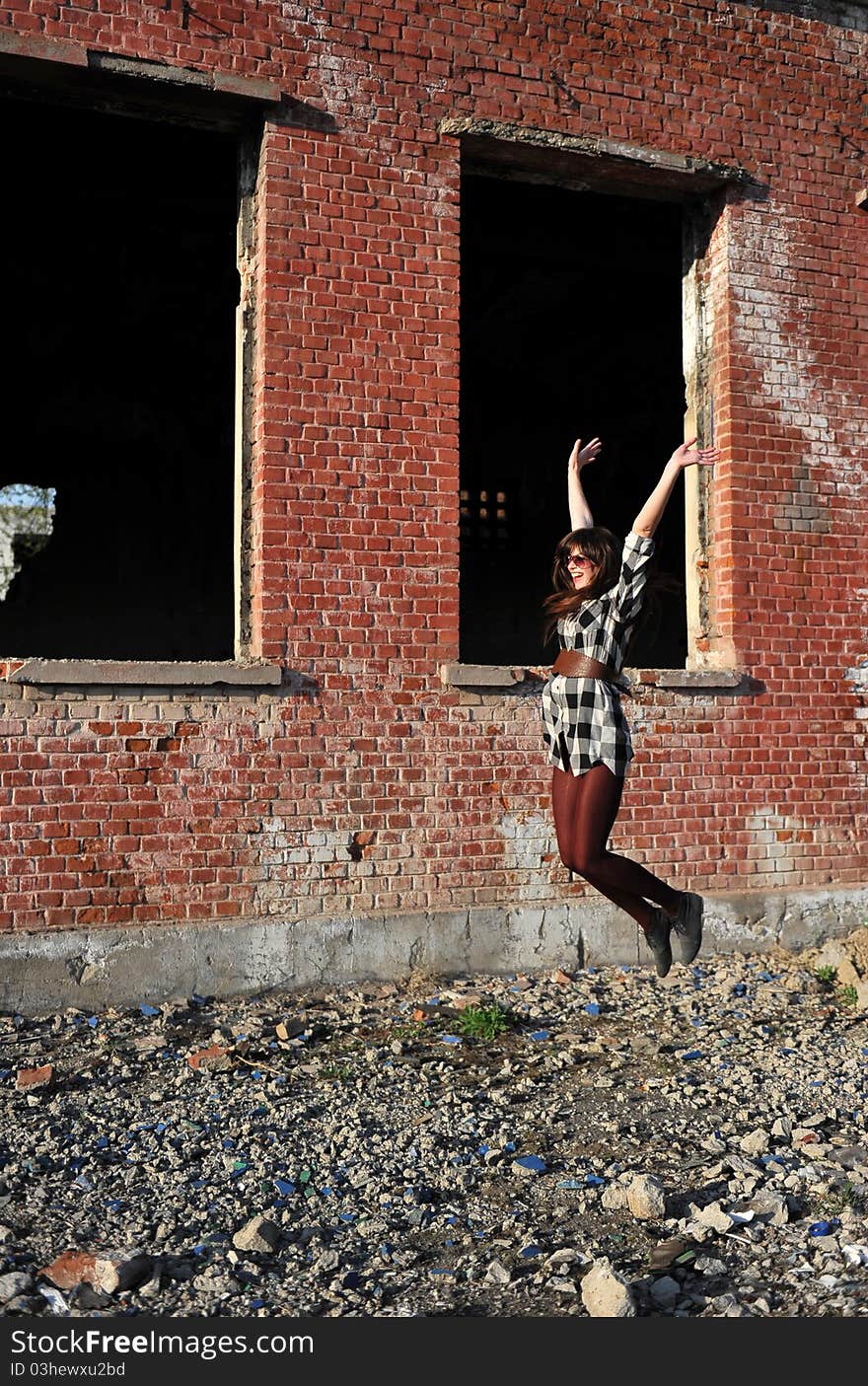 Portrait with happy young woman jumping