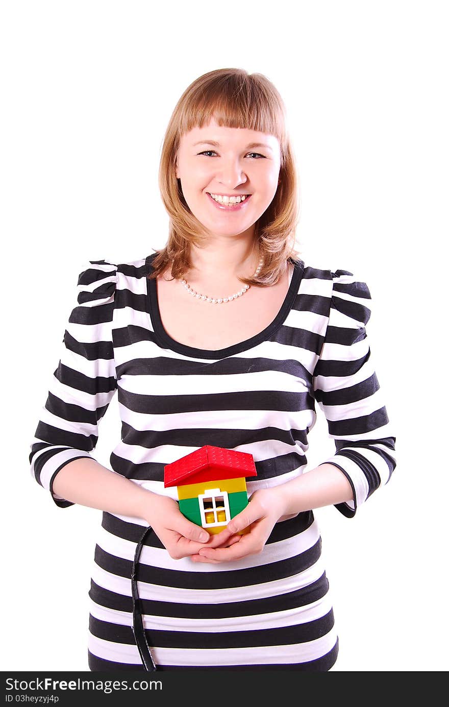 Young woman with house's model. Isolated on white background.