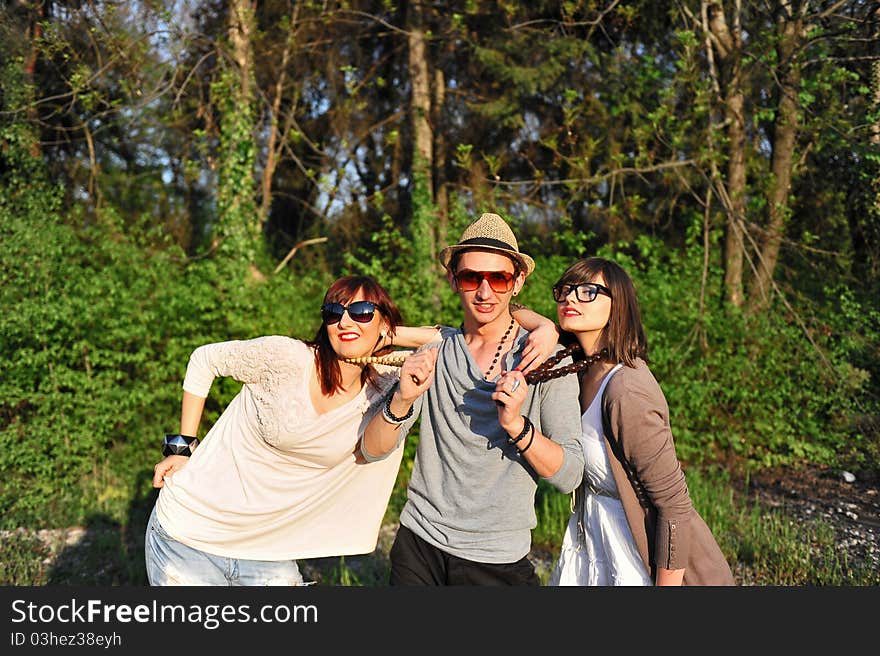 Young man seducing two women. Young man seducing two women