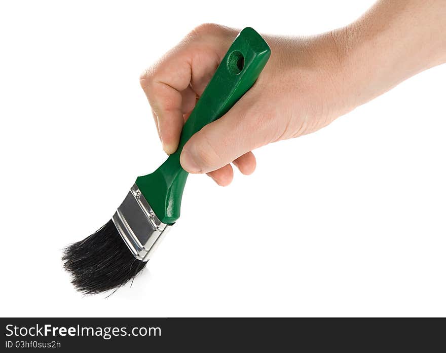 Male hand and green brush isolated on white background