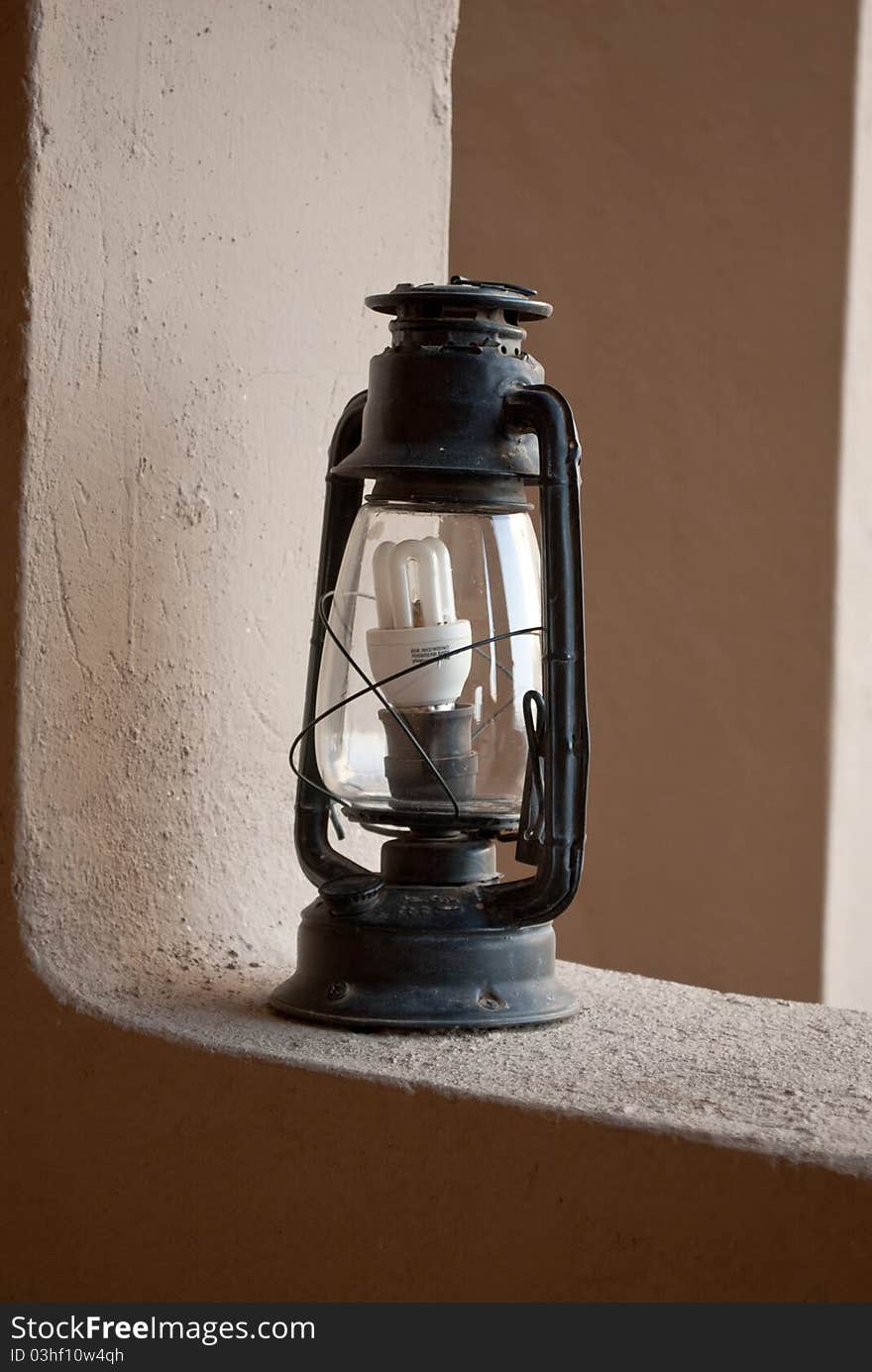 An antique lantern shot with a modern lamp