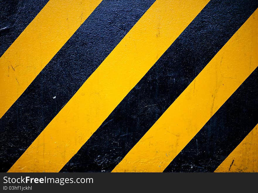 Pattern yellow and black is sign warning something on the road.