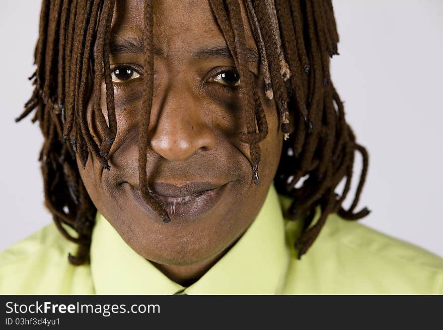 Closeup Portrait of an African American Businessman with Dreadlocks Hanging in front of His Eyes. Closeup Portrait of an African American Businessman with Dreadlocks Hanging in front of His Eyes