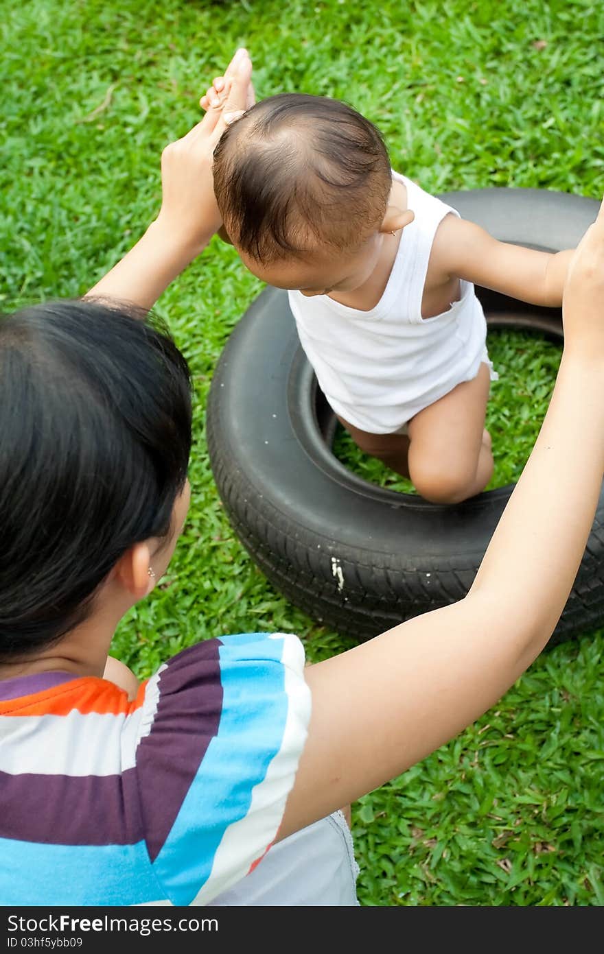 Asian ethnic mother assist child to overcome barrier. Asian ethnic mother assist child to overcome barrier