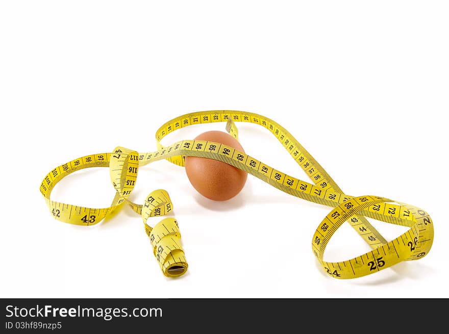 Egg and measuring tape isolated on white background